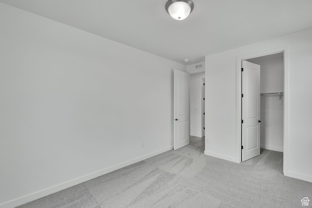 376 W Emma St Unit 623, Grantsville, UT 84029 - unfurnished bedroom with carpet, baseboards, a walk in closet, and a closet