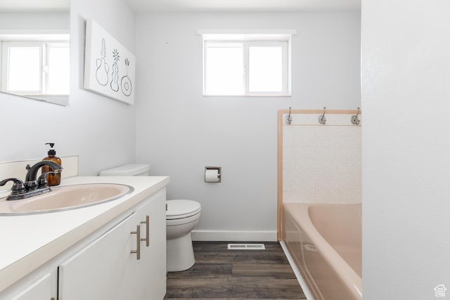 750 N 100 W, Logan, UT 84321 - bathroom featuring toilet, wood finished floors, vanity, and baseboards