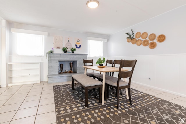 750 N 100 W, Logan, UT 84321 - tiled dining space featuring wainscoting and a fireplace with raised hearth