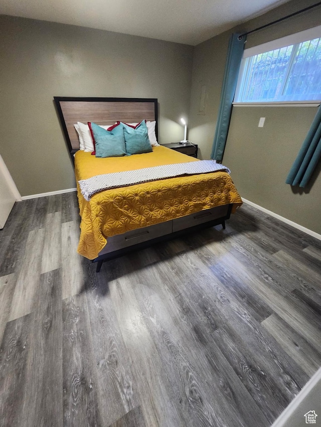 750 N 100 W, Logan, UT 84321 - bedroom featuring wood finished floors and baseboards
