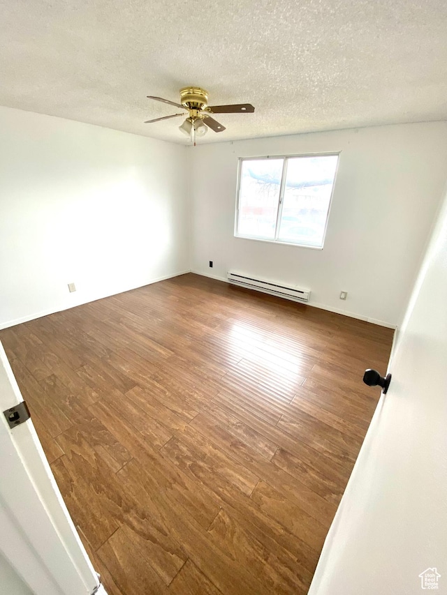 5444 W Bailiff Dr S, Kearns, UT 84118 - empty room with a ceiling fan, wood finished floors, a textured ceiling, and baseboard heating