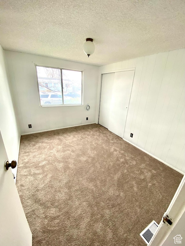 5444 W Bailiff Dr S, Kearns, UT 84118 - empty room with carpet, a textured ceiling, and visible vents