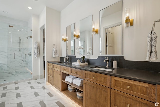 full bathroom featuring double vanity, a marble finish shower, a sink, and recessed lighting