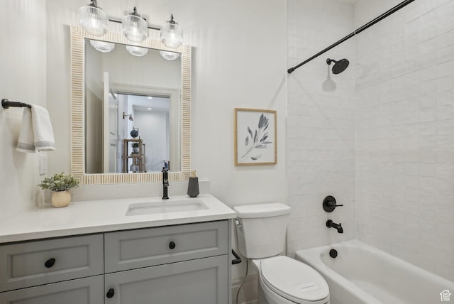 bathroom featuring toilet, shower / bathtub combination, a closet, and vanity