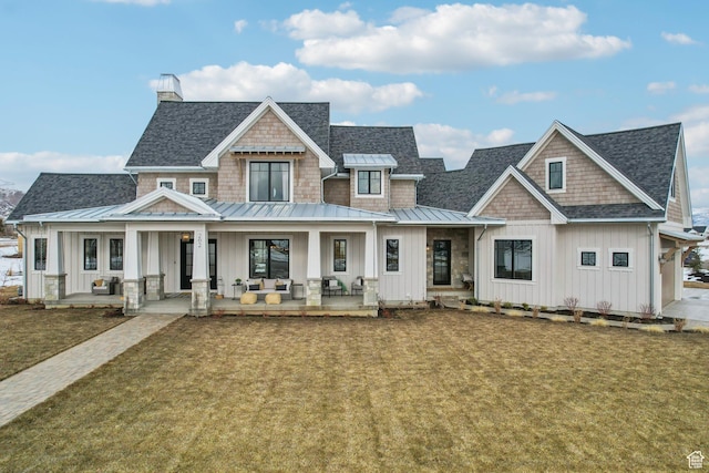 view of front of house with a porch, a standing seam roof, and board and batten siding
