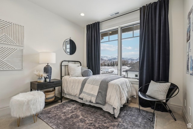 bedroom featuring carpet floors, recessed lighting, visible vents, a mountain view, and baseboards