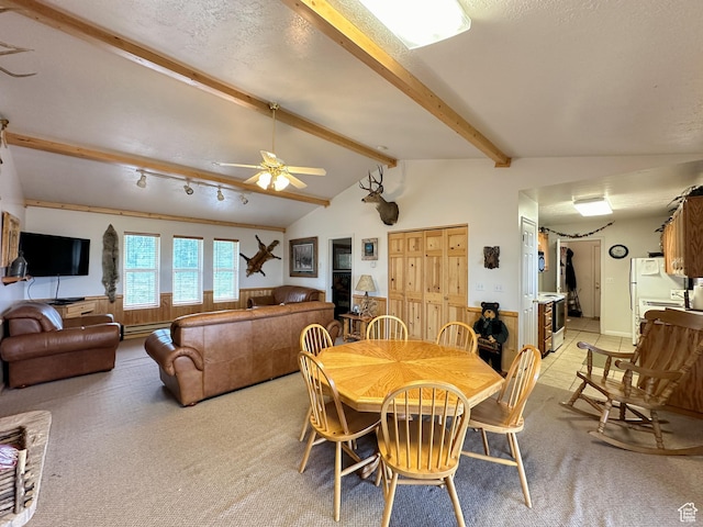 dining room featuring vaulted ceiling with beams, a ceiling fan, and light colored carpet