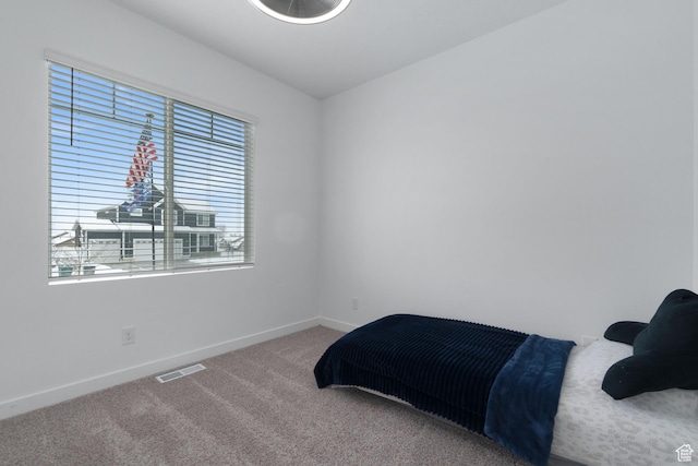 1033 E Bigelow Ave, Layton, UT 84040 - bedroom with visible vents, carpet floors, and baseboards