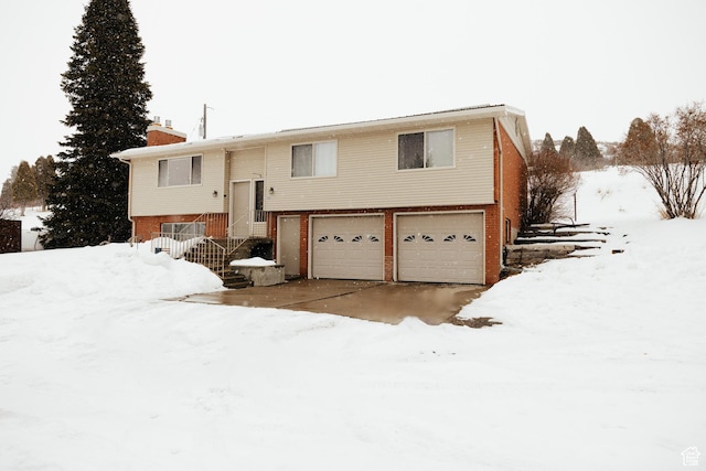 322 Bailey Rd, Soda Springs, ID 83276 - raised ranch with an attached garage, a chimney, and brick siding