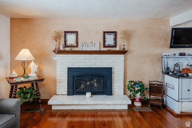 322 Bailey Rd, Soda Springs, ID 83276 - living area featuring wood-type flooring, baseboards, and a fireplace