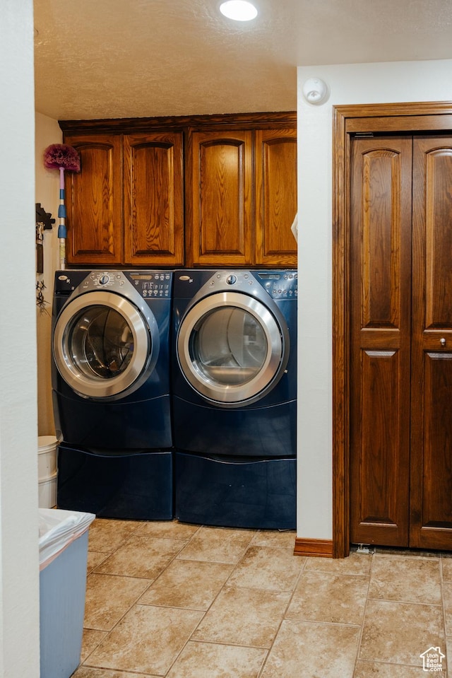 322 Bailey Rd, Soda Springs, ID 83276 - laundry room featuring washer and dryer, cabinet space, and baseboards