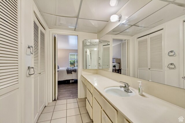 4953 S Eastridge Ln E Unit 143, Salt Lake City, UT 84117 - bathroom with a closet, connected bathroom, vanity, and tile patterned floors