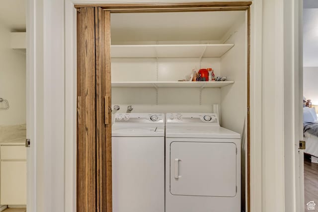 4953 S Eastridge Ln E Unit 143, Salt Lake City, UT 84117 - clothes washing area with washing machine and clothes dryer