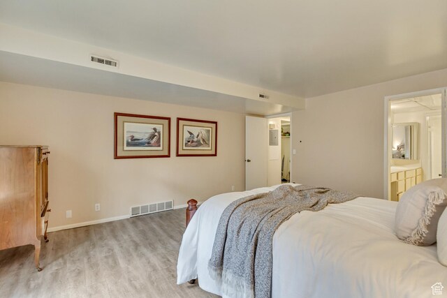 4953 S Eastridge Ln E Unit 143, Salt Lake City, UT 84117 - bedroom featuring light wood-style floors, baseboards, and visible vents