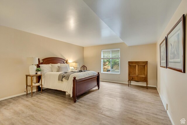 4953 S Eastridge Ln E Unit 143, Salt Lake City, UT 84117 - bedroom with light wood-type flooring and baseboards