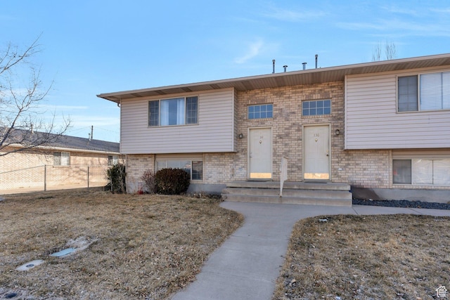 134 N 300 W, Spanish Fork, UT 84660 - raised ranch featuring brick siding and fence