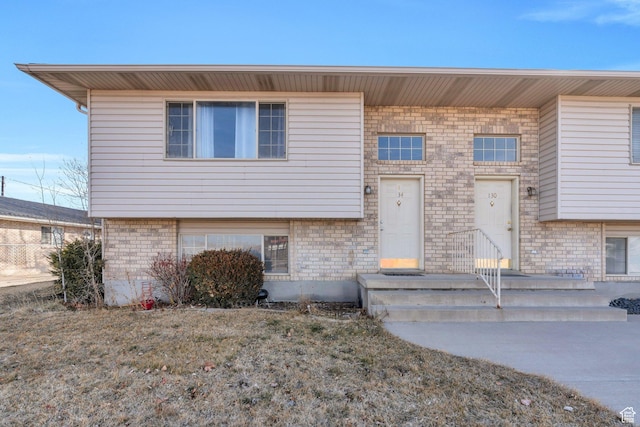 view of front of home with brick siding