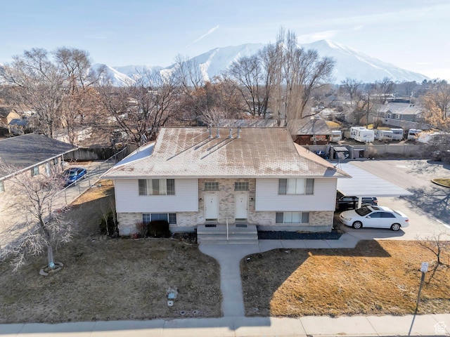 134 N 300 W, Spanish Fork, UT 84660 - view of front of home featuring a shingled roof, a residential view, and a mountain view