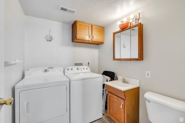 134 N 300 W, Spanish Fork, UT 84660 - laundry area featuring visible vents, a sink, a textured ceiling, washer and dryer, and laundry area