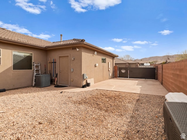 1908 S Yuma Dr, Washington, UT 84780 - back of property featuring stucco siding and a patio