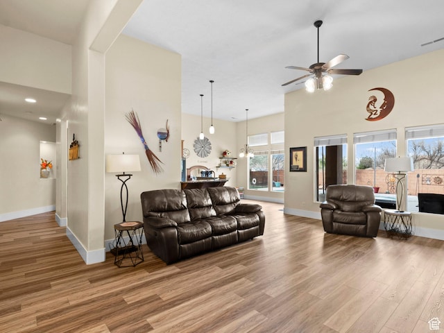 1908 S Yuma Dr, Washington, UT 84780 - living room featuring wood finished floors, ceiling fan, and a high ceiling