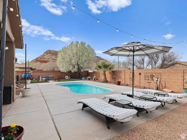 1908 S Yuma Dr, Washington, UT 84780 - view of pool featuring a mountain view, a fenced backyard, and a patio
