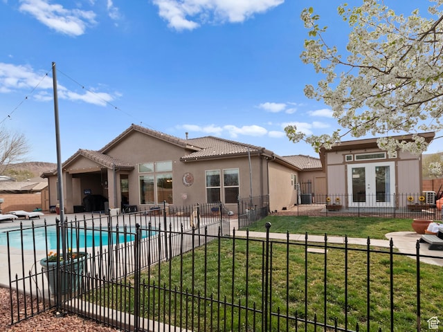 1908 S Yuma Dr, Washington, UT 84780 - rear view of house featuring french doors, a tile roof, stucco siding, and a patio