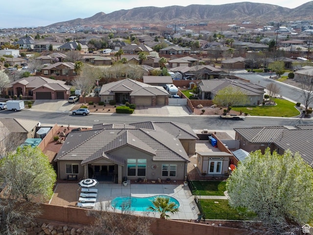 1908 S Yuma Dr, Washington, UT 84780 - aerial view of residential area featuring a mountainous background and a pool area