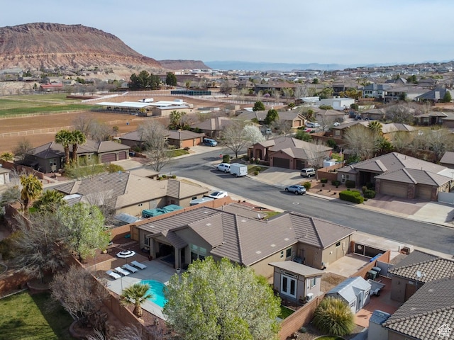 1908 S Yuma Dr, Washington, UT 84780 - aerial view of residential area with a mountain backdrop and a pool area