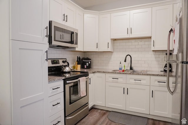 1055 S 500 E Unit D204, Heber City, UT 84032 - kitchen with stainless steel appliances, light stone countertops, and white cabinets