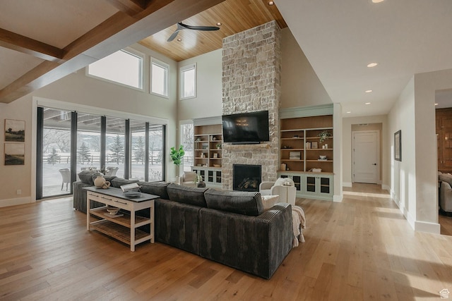 1685 W Midway Ln, Heber City, UT 84032 - living area featuring baseboards, light wood finished floors, ceiling fan, high vaulted ceiling, and a fireplace