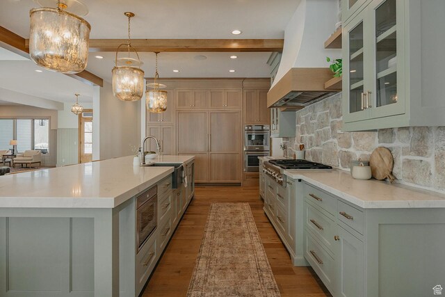 1685 W Midway Ln, Heber City, UT 84032 - kitchen with a notable chandelier, light wood-style flooring, a sink, premium range hood, and appliances with stainless steel finishes