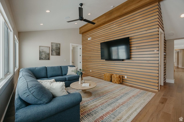 1685 W Midway Ln, Heber City, UT 84032 - living area with a ceiling fan, lofted ceiling, wood walls, an accent wall, and wood finished floors