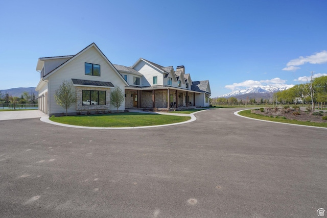 1685 W Midway Ln, Heber City, UT 84032 - modern farmhouse style home with metal roof, a chimney, a standing seam roof, and a mountain view