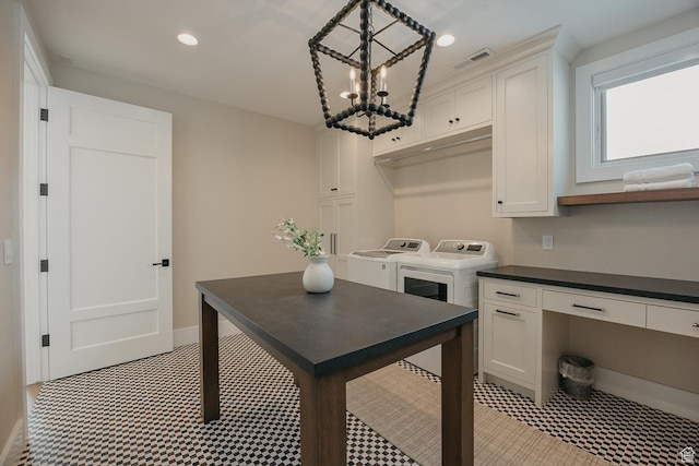 1685 W Midway Ln, Heber City, UT 84032 - kitchen with white cabinetry, dark countertops, washing machine and dryer, and visible vents