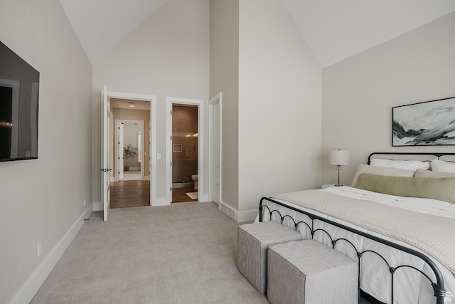 1685 W Midway Ln, Heber City, UT 84032 - bedroom featuring light colored carpet, connected bathroom, baseboards, and high vaulted ceiling