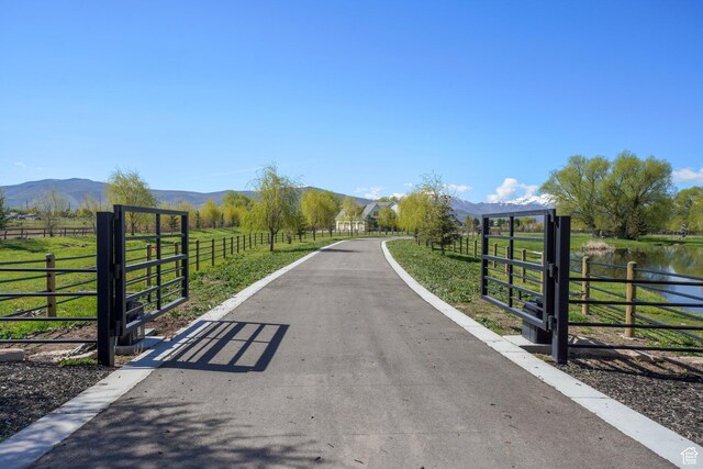 1685 W Midway Ln, Heber City, UT 84032 - view of road with a water and mountain view, a gated entry, a rural view, and driveway
