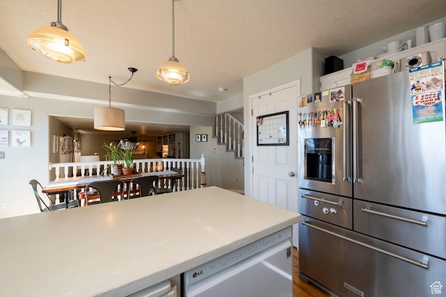 1446 E Murdock Dr S, Pleasant Grove, UT 84062 - kitchen with a textured ceiling, light countertops, appliances with stainless steel finishes, and pendant lighting