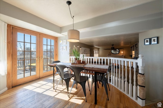 1446 E Murdock Dr S, Pleasant Grove, UT 84062 - dining room with light wood finished floors, baseboards, a textured ceiling, and french doors