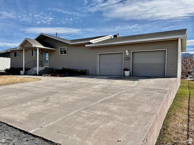 404 N 1st E, Grace, ID 83241 - view of front of house featuring a shingled roof, a garage, and concrete driveway
