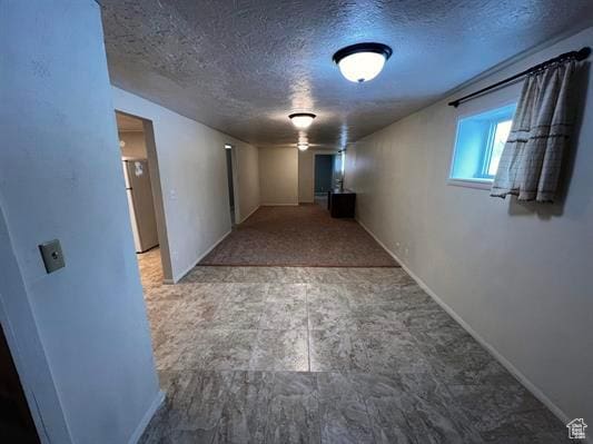 404 N 1st E, Grace, ID 83241 - hallway featuring baseboards and a textured ceiling