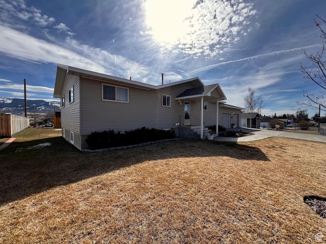 404 N 1st E, Grace, ID 83241 - exterior space with driveway, fence, and a lawn