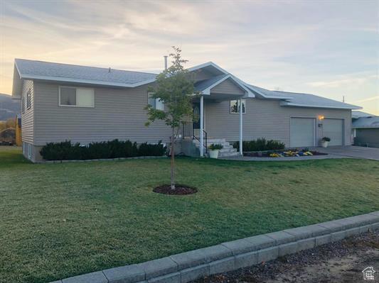 404 N 1st E, Grace, ID 83241 - single story home featuring concrete driveway, a garage, and a yard