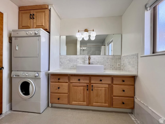 404 N 1st E, Grace, ID 83241 - clothes washing area with a wealth of natural light, laundry area, stacked washer / dryer, and a sink