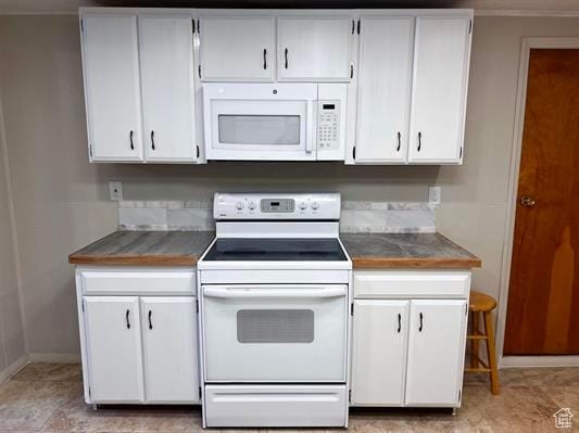 404 N 1st E, Grace, ID 83241 - kitchen with white cabinetry and white appliances