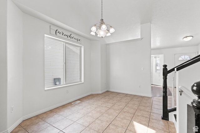 257 Rosewood Cir, Logan, UT 84321 - interior space with light tile patterned floors, visible vents, baseboards, stairs, and an inviting chandelier