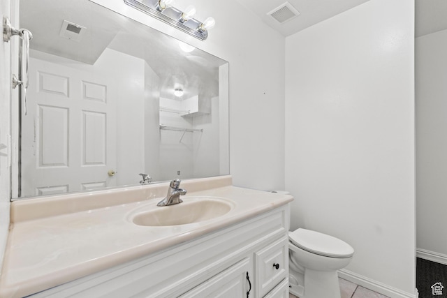 257 Rosewood Cir, Logan, UT 84321 - bathroom featuring toilet, a spacious closet, visible vents, and vanity
