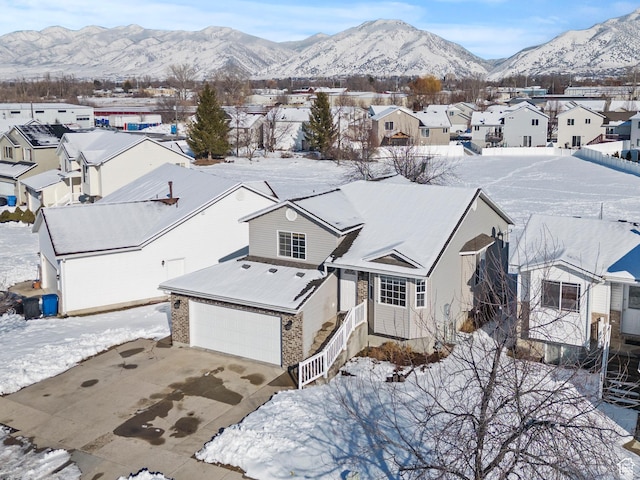 257 Rosewood Cir, Logan, UT 84321 - snowy aerial view with a residential view and a mountain view