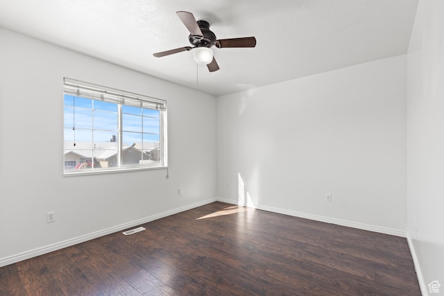 257 Rosewood Cir, Logan, UT 84321 - unfurnished room with dark wood-style floors, visible vents, baseboards, and a ceiling fan