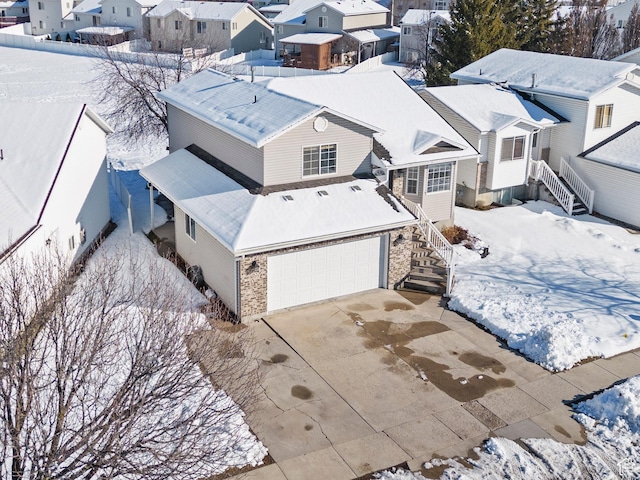 257 Rosewood Cir, Logan, UT 84321 - snowy aerial view with a residential view